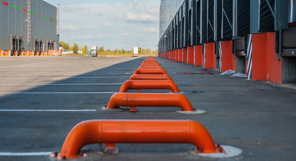 Cargo doors at big industrial warehouse building