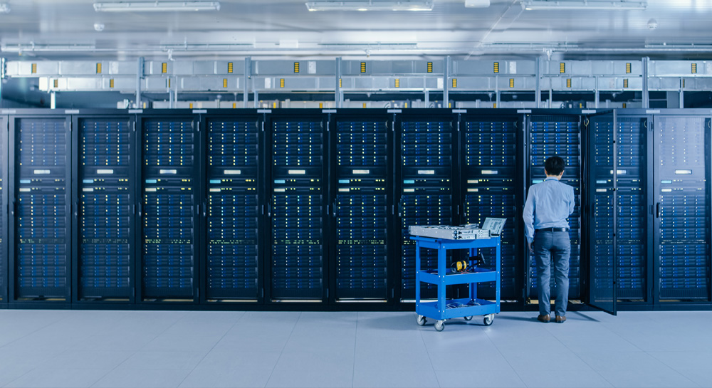 IT Engineer Working with Server Racks