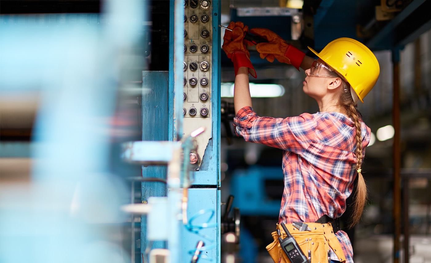 Technician working on an electrical panel
