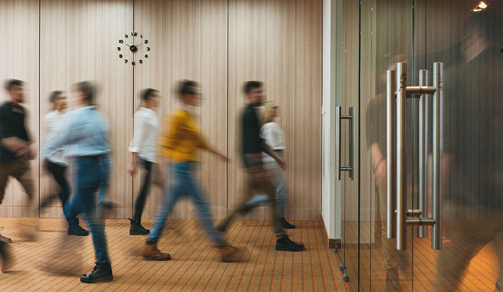 Group of office people walking at office open space