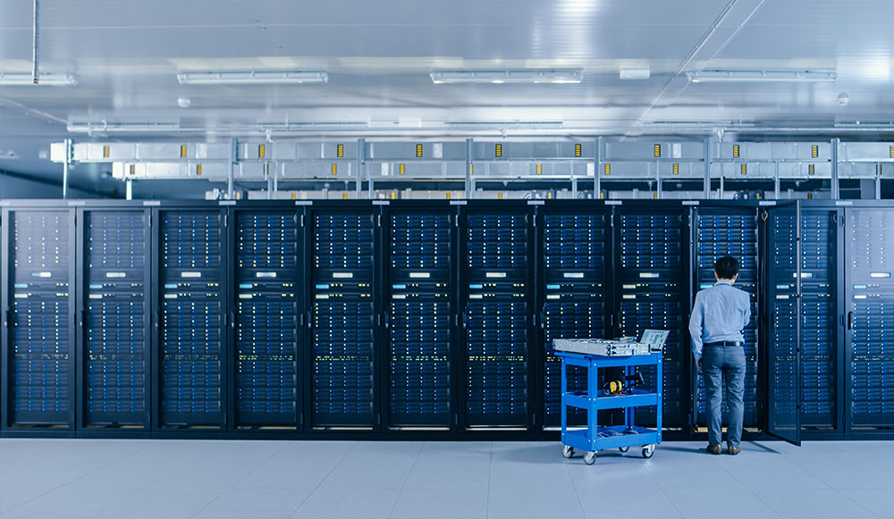 IT Engineer Working with Server Racks