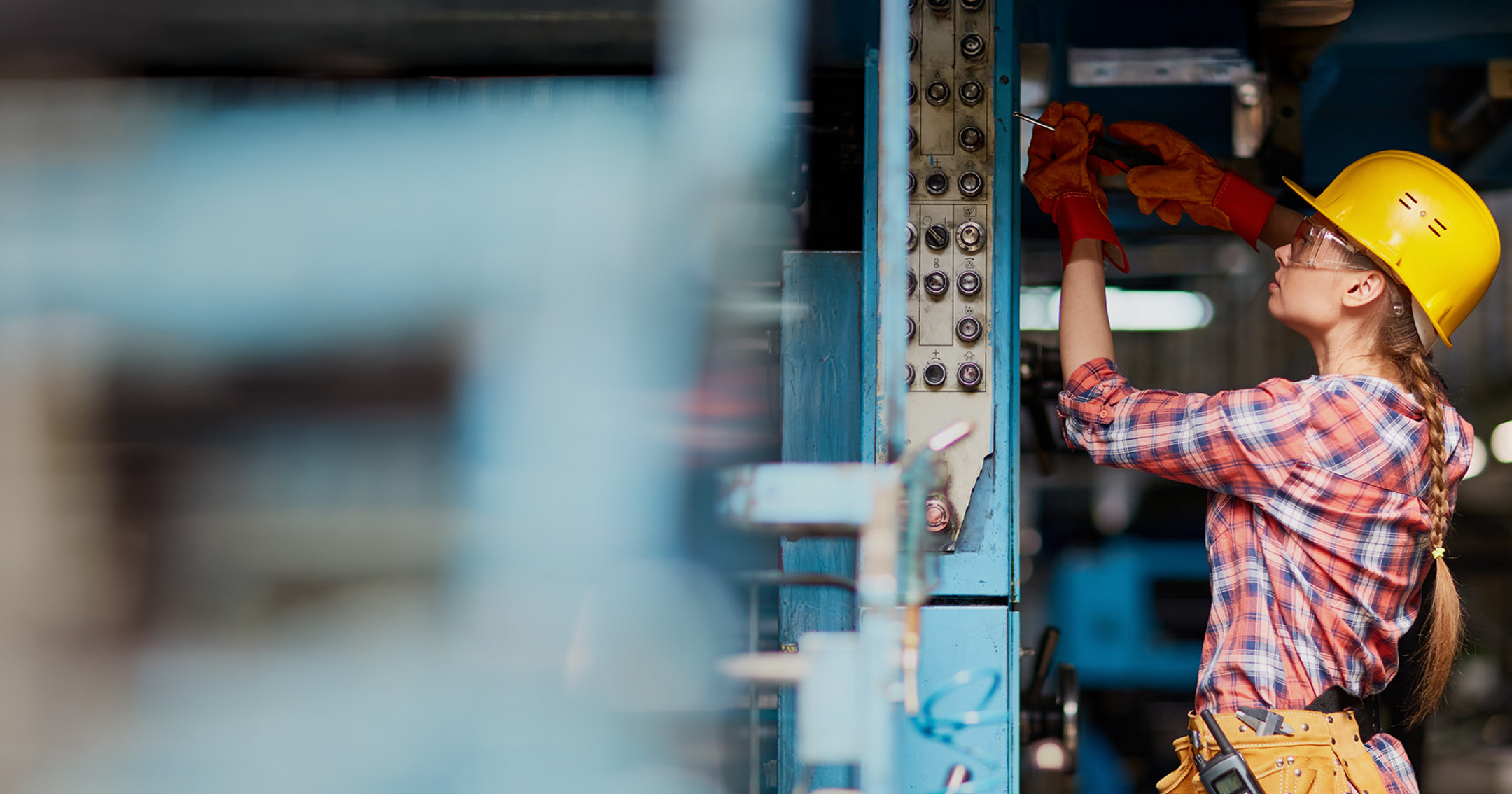 Technician working on an electrical panel