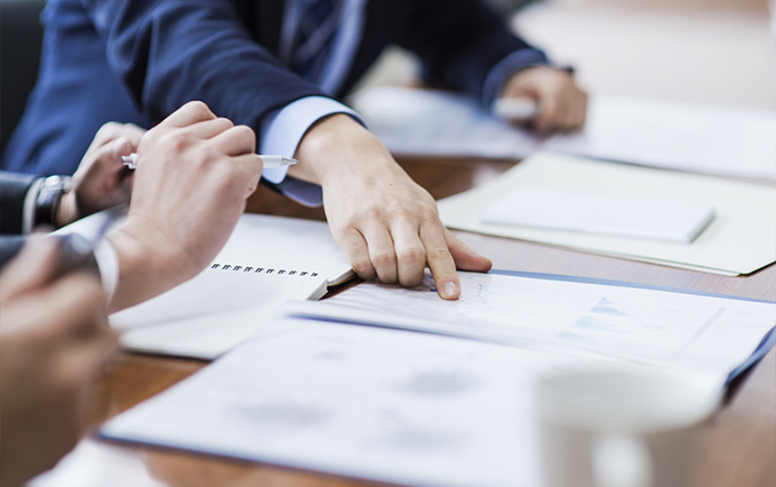 Business professionals reviewing documents