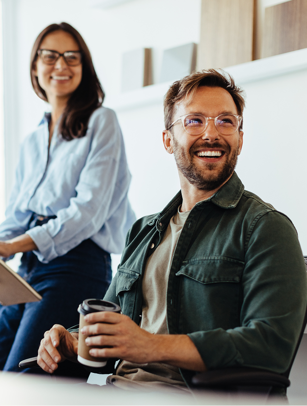 Colleagues smiling during a meeting