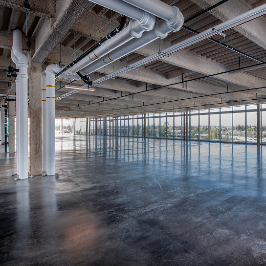 Empty commercial space with large windows