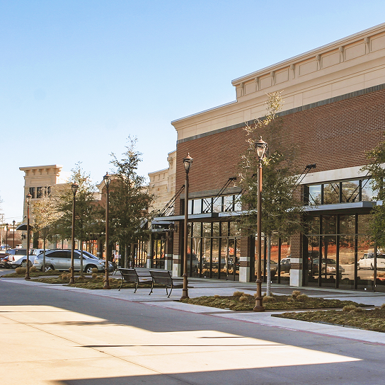 Street view of retail shops with trees