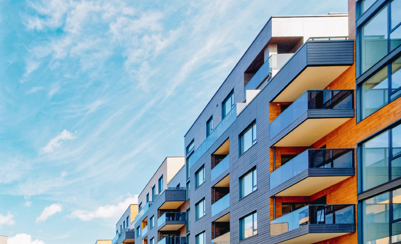 Modern residential building against a blue sky