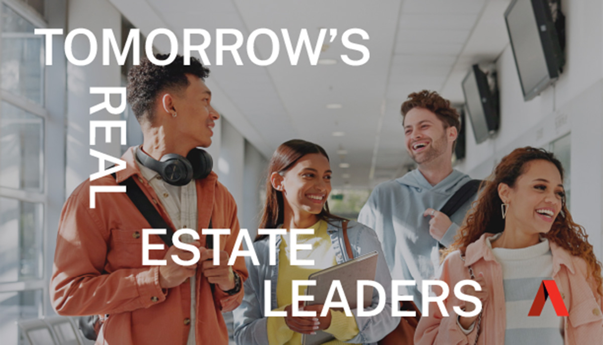 College students happily walking down a hallway together