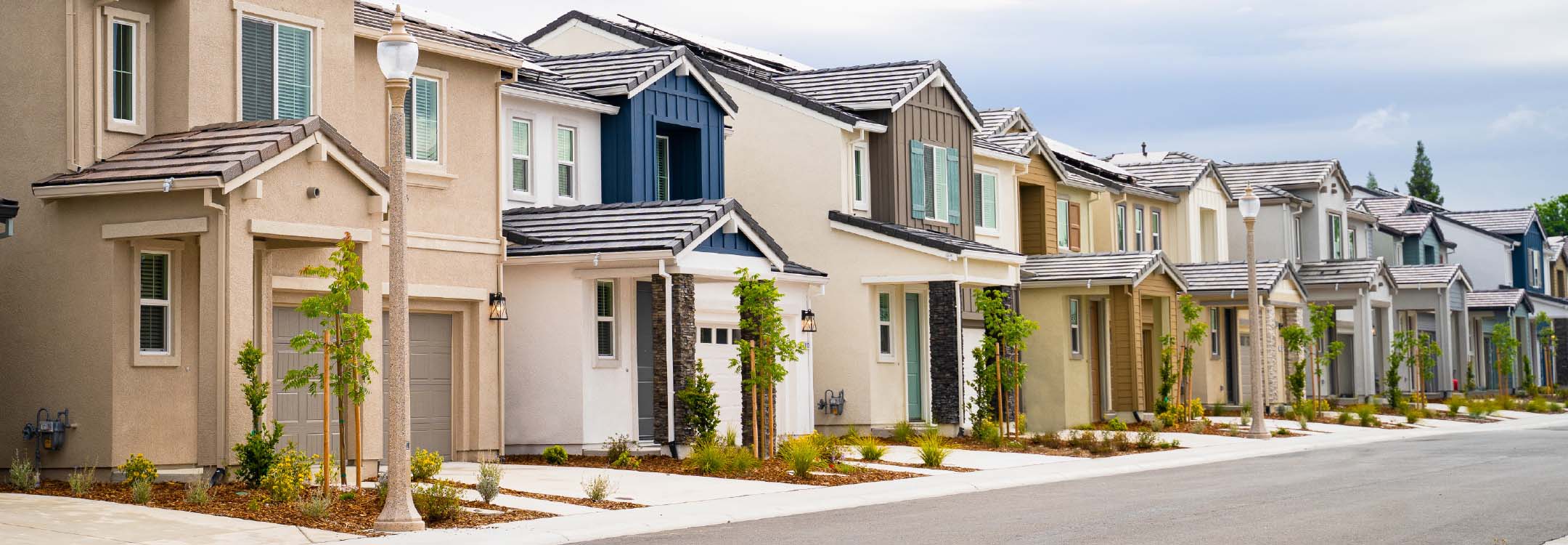 A row of single-family rental homes on a clean street.
